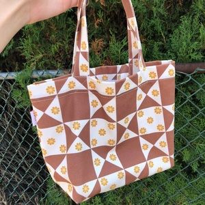 lisa says gah! baby tote in floral quilt toasted pecan print
